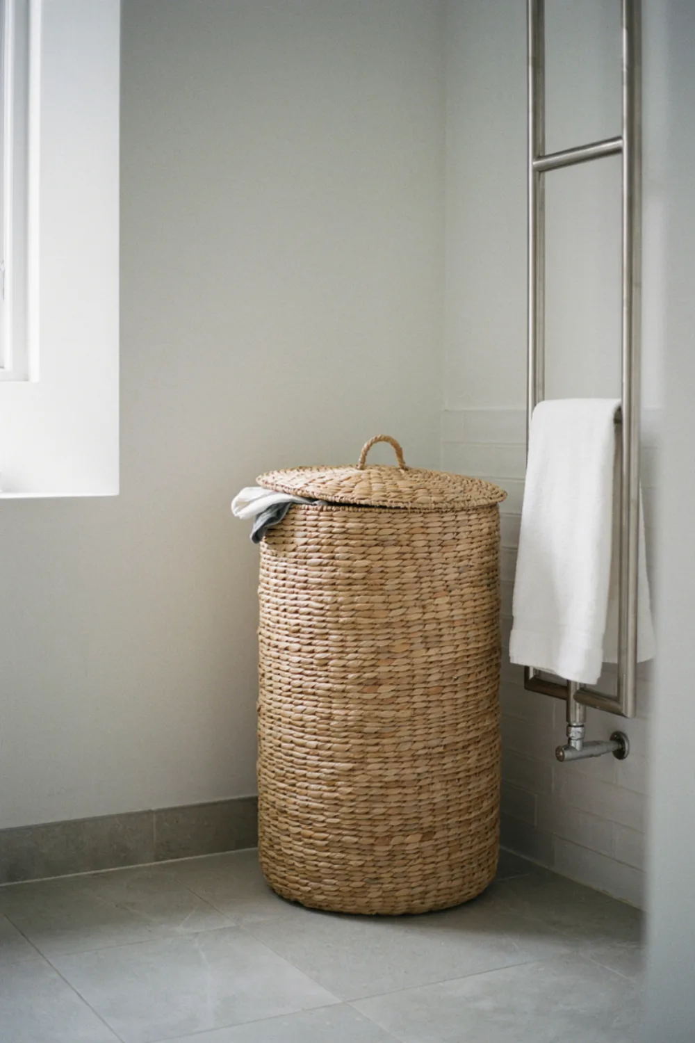 Spa-style bathroom with plants and candles: choose a Lidded Hamper That Looks Like Furniture