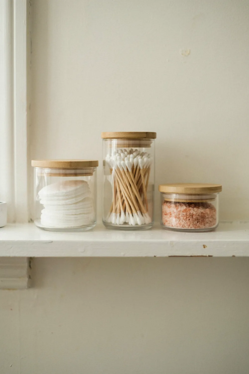 Spa-style bathroom with plants and candles: keep Cotton Goods in Glass Jars With Wooden Lids