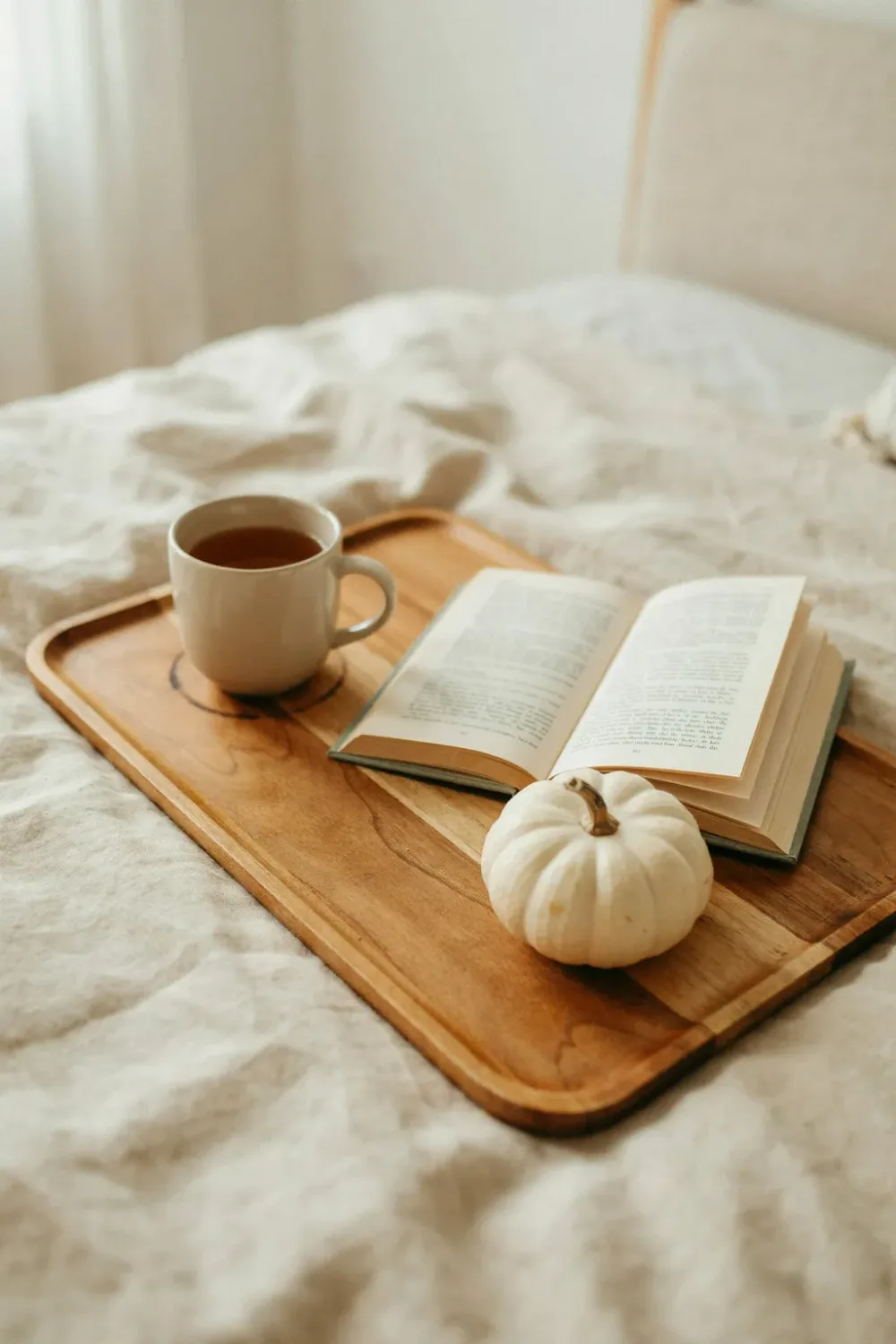 Cozy fall bedroom in warm feminine tones: set a Wooden Tray on the Bed