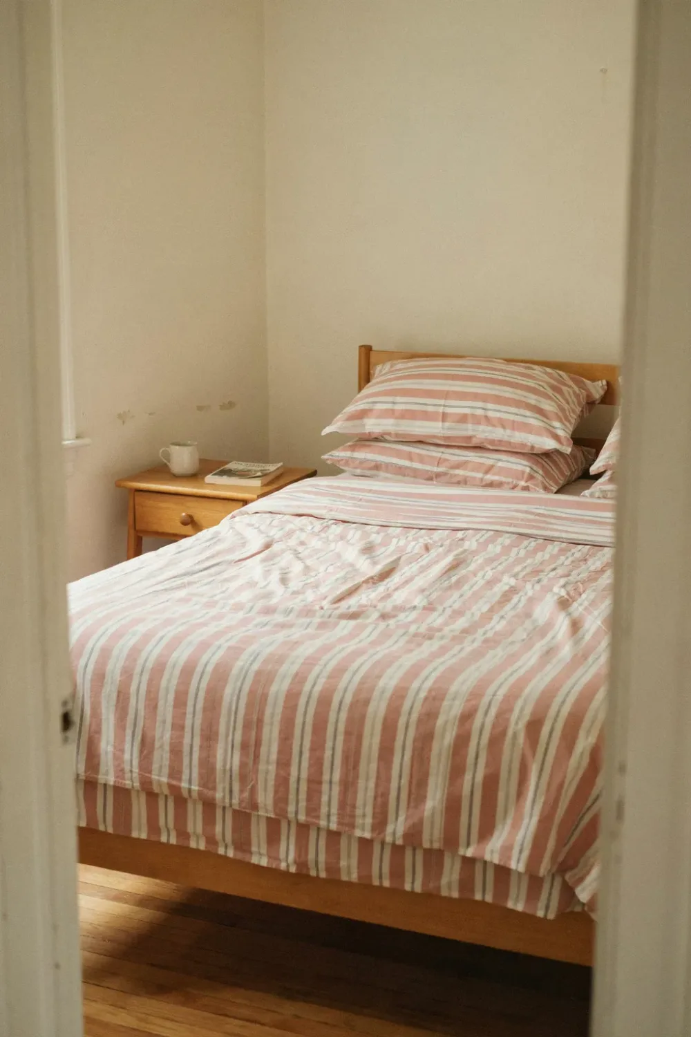 Dreamy blush pink bedroom: try Pink-and-Cream Striped Bedding