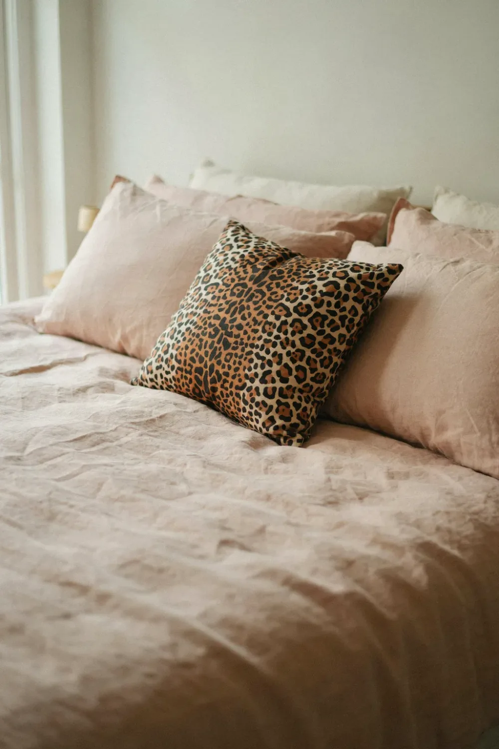 Dreamy blush pink bedroom: add One Leopard-Print Cushion