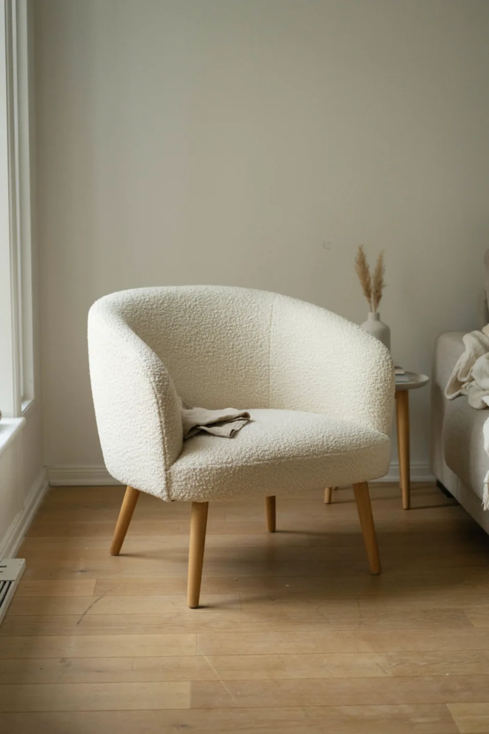 Neutral scandinavian living room: add a Bouclé or Wool Accent Chair