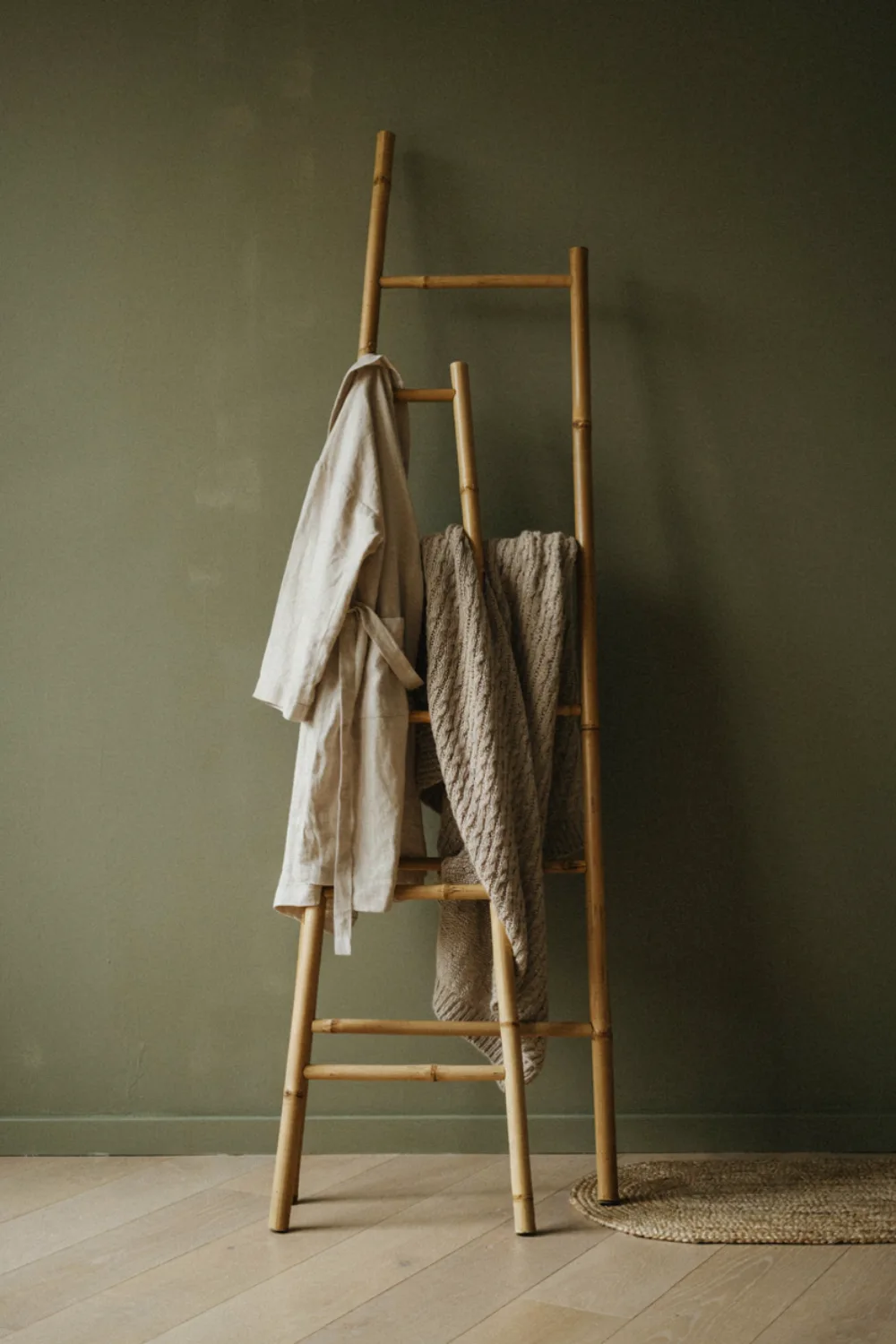 Minimal olive green japanese zen bedroom: stand a Bamboo Ladder for Robes and Throws