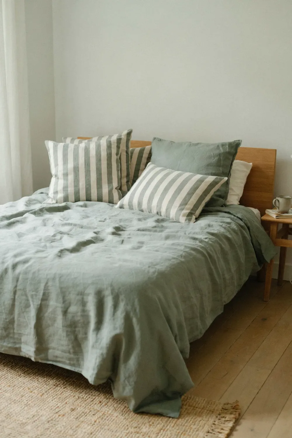 Warm sage green bedroom: mix Sage-and-Cream Striped Cushions