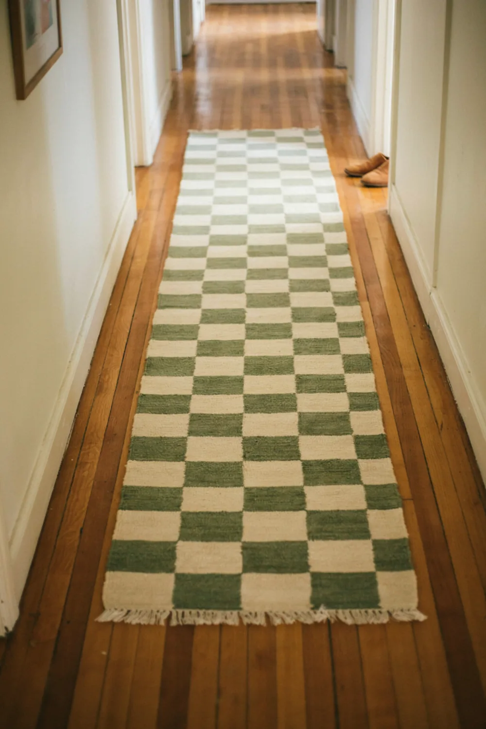 Simple diy home project in progress: paint a Checkerboard on a Plain Runner Rug