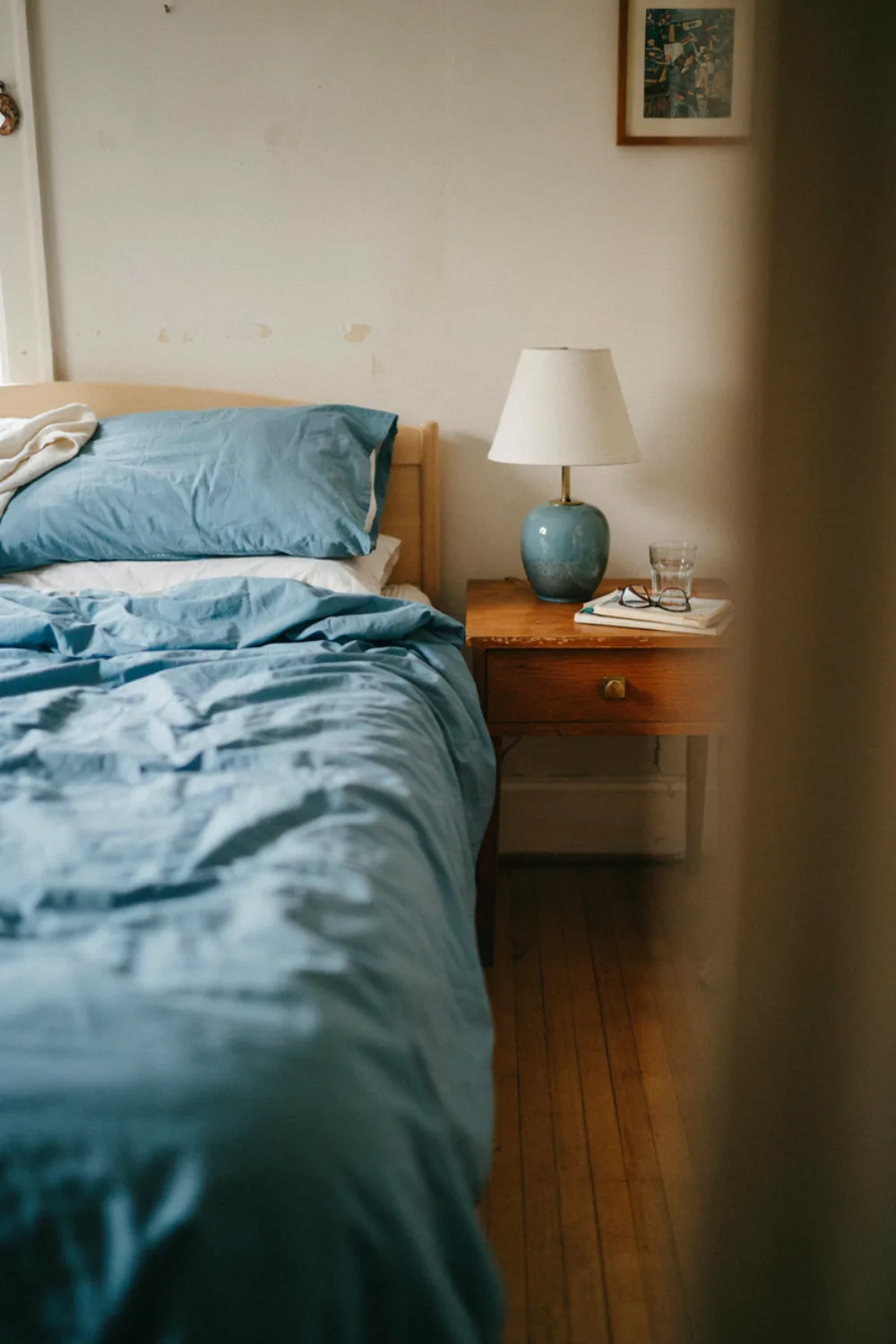 Calm bedroom with sky blue bedding: set a Small Blue Ceramic Lamp by the Bed