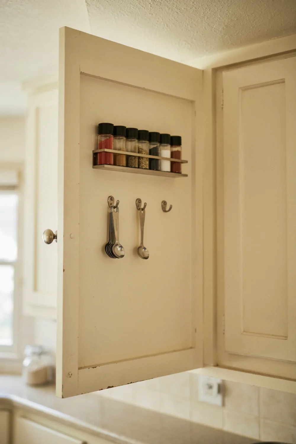 Bright tiny kitchen: use the Inside of Cabinet Doors