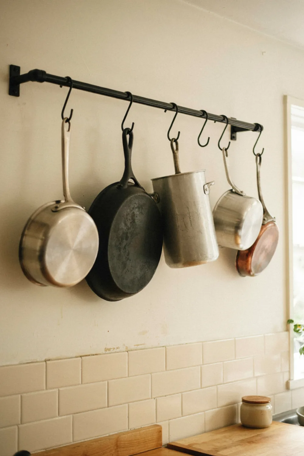 Bright tiny kitchen: hang Pots From a Wall or Ceiling Rail